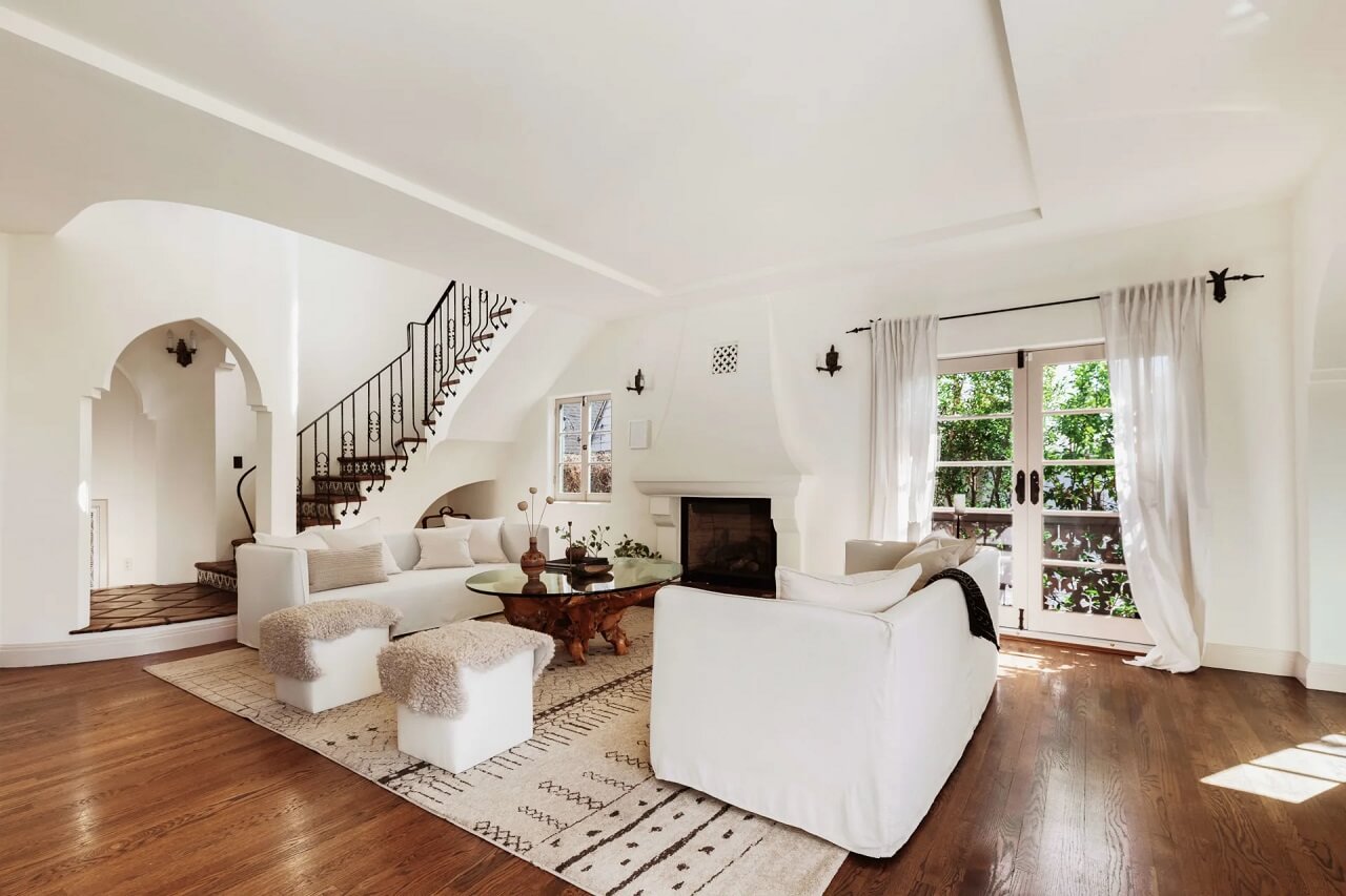 white-living-room-large-rug-staircase-nordroom