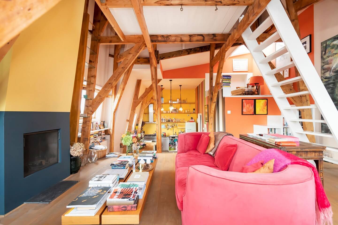 colorful-loft-apartment-pink-sofa-fireplace-nordroom