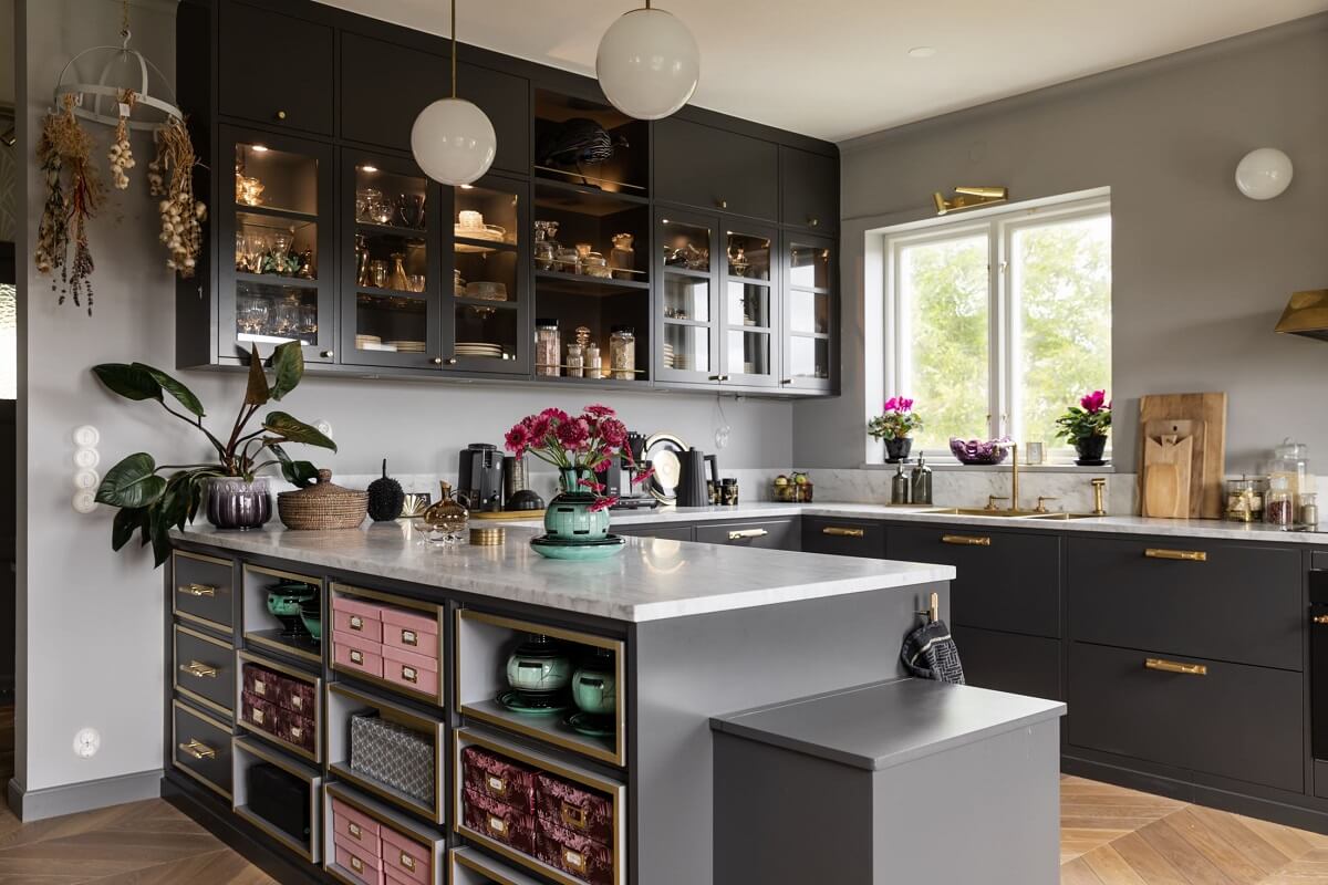 gray-kitchen-brass-fittings-glass-cabinets-nordroom