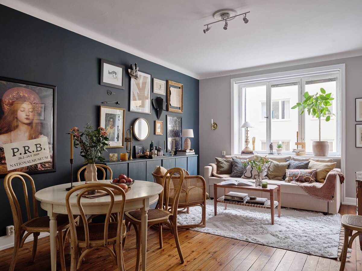 living-room-dark-blue-accent-wall-ikea-ivar-cabnets-round-dining-table-nordroom