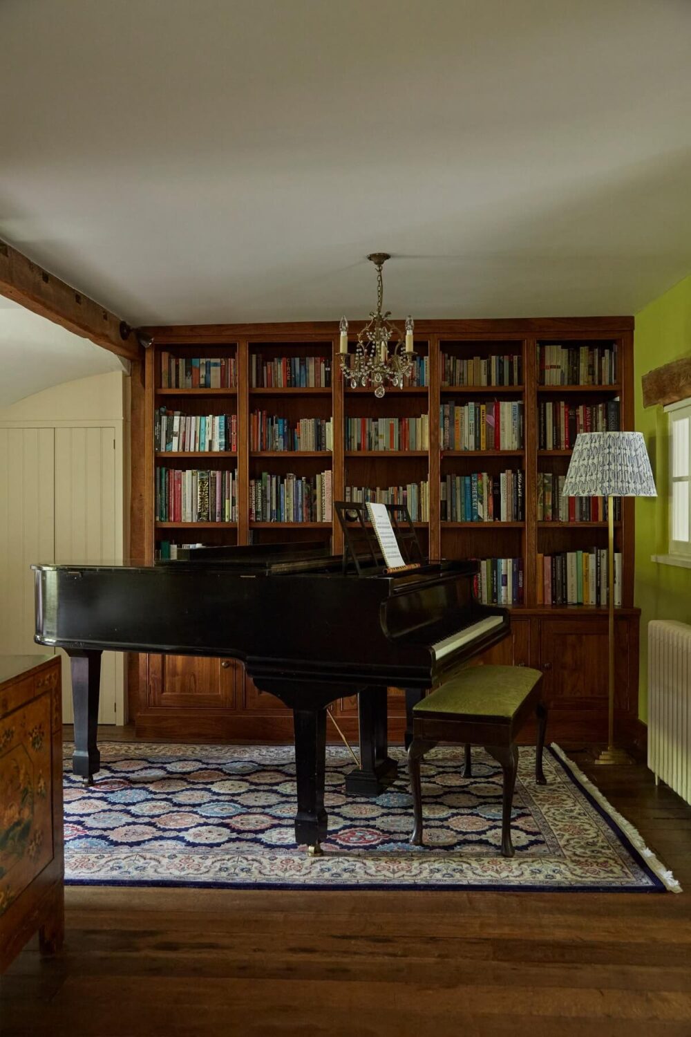 music-room-built-in-bookshelves-piano-wooden-floor-english-cottage-nordroom