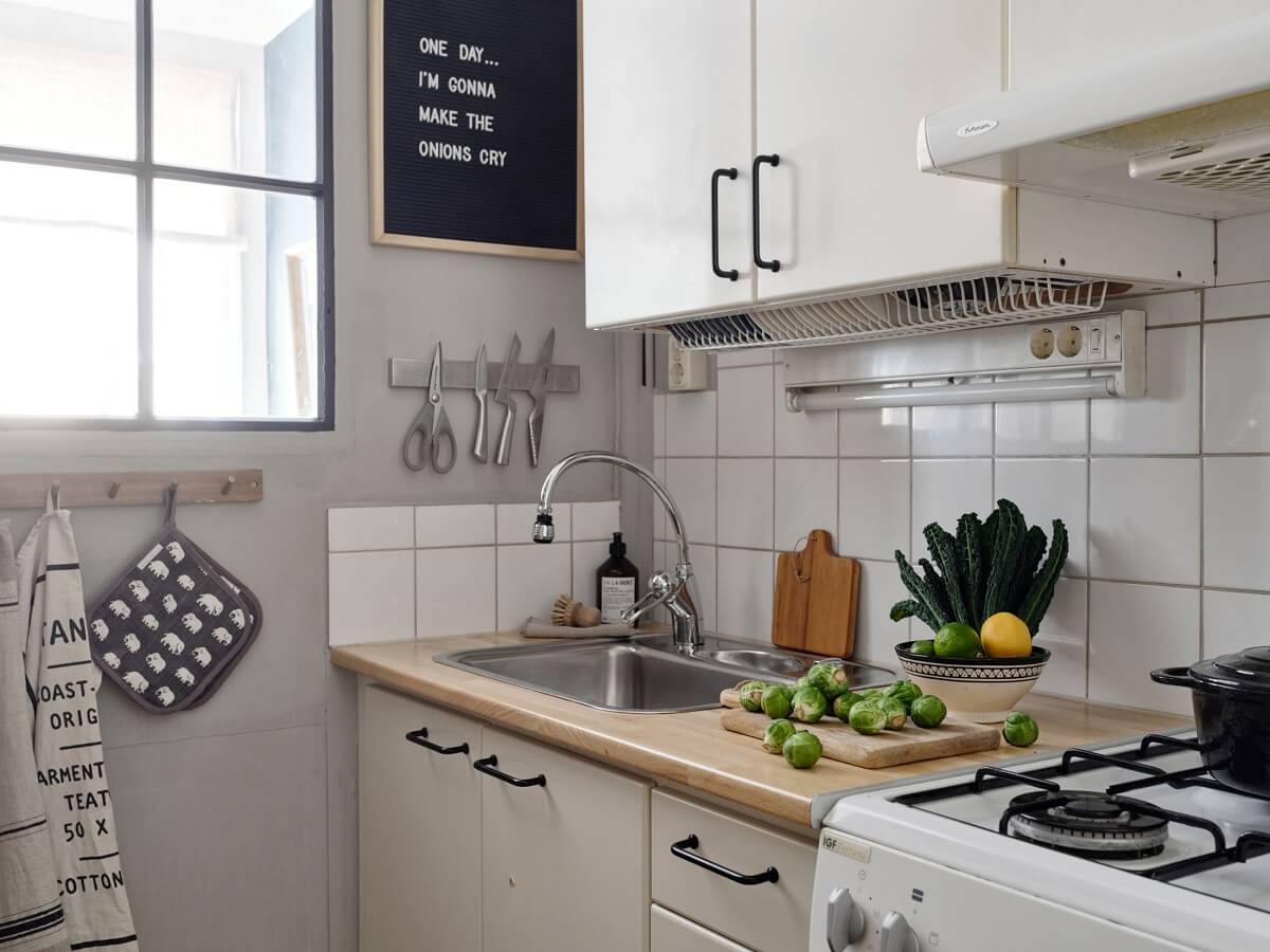 small-galley-kitchen-indoor-window-light-gray-walls-nordroom