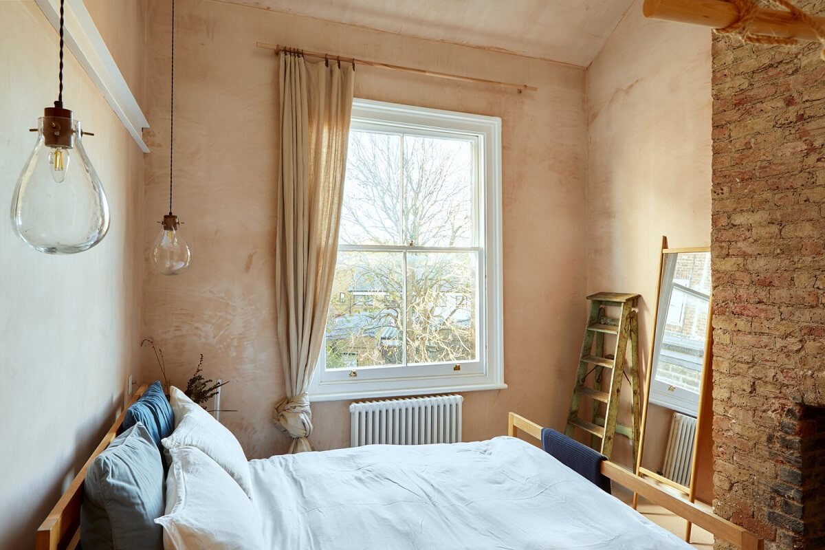 bedroom-plaster-pink-walls-exposed-brick-walls-nordroom