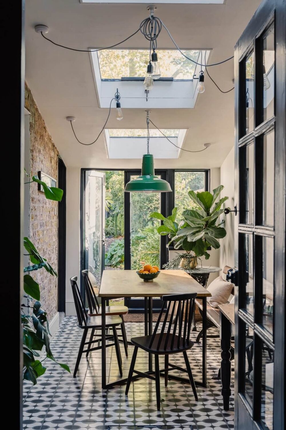 dining-room-exterion-brick-wall-floor-tiles-skylight-nordroom