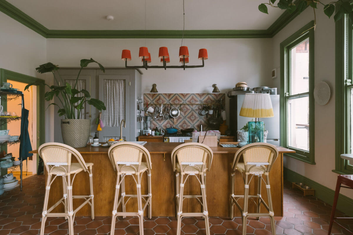 kitchen-island-breakfast-bar-green-trimmings-handmade-terracotta-floor-tiles-nordroom