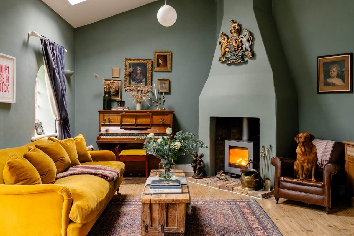 living-room-green-walls-farrow-ball-card-room-green-ochre-yellow-sofa-fireplace-vintage-art-nordroom