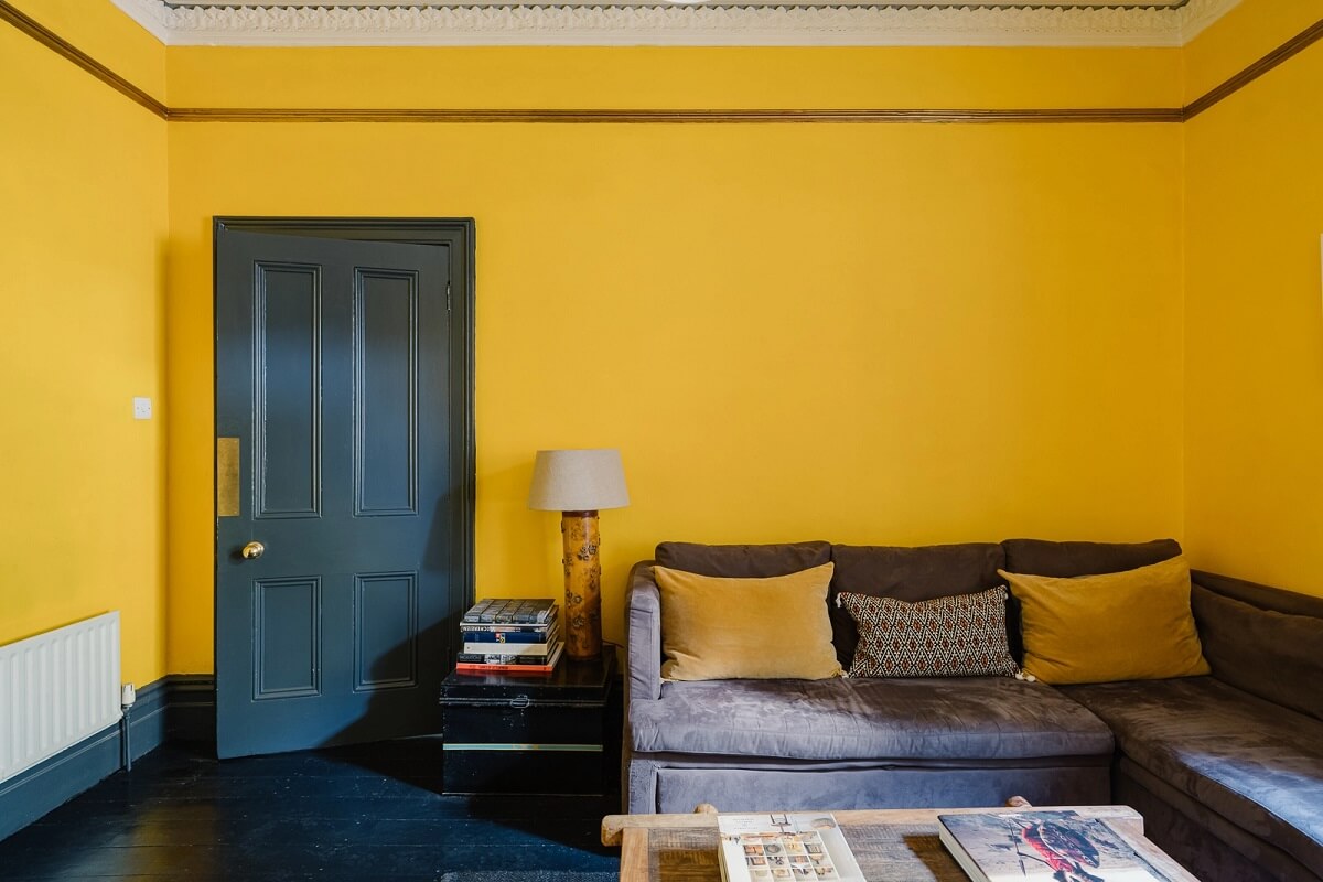 sitting-room-yellow-walls-dark-gray-floorboards-nordroom