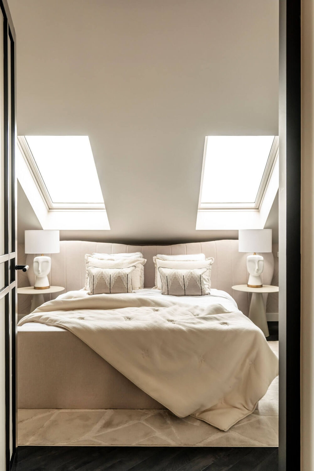 white-bedroom-slanted-ceiling-skylights-nordroom