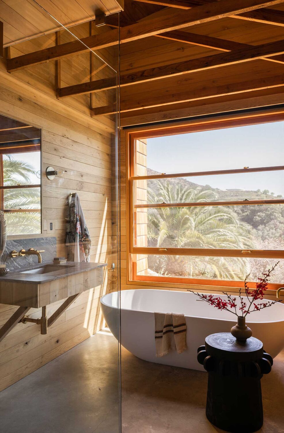 wooden-bathroom-pitched-roof-exposed-beams-freestanding-bath-nordroom