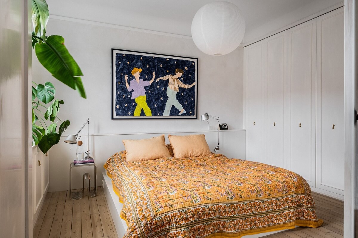 bedroom-wooden-floor-yellow-bedding-built-in-wardrobes-nordroom