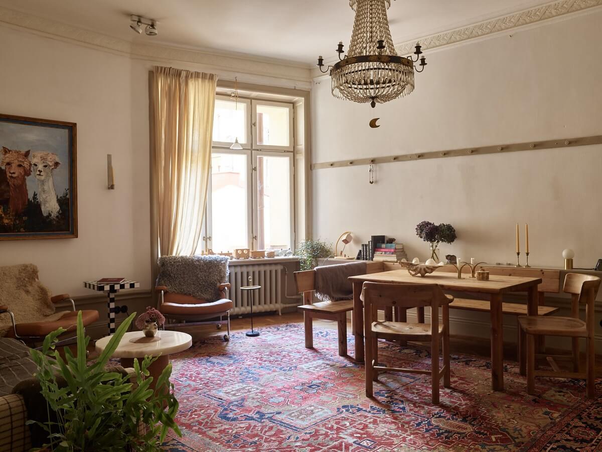 beige-vintage-living-room-large-rug-wooden-dining-area-nordroom