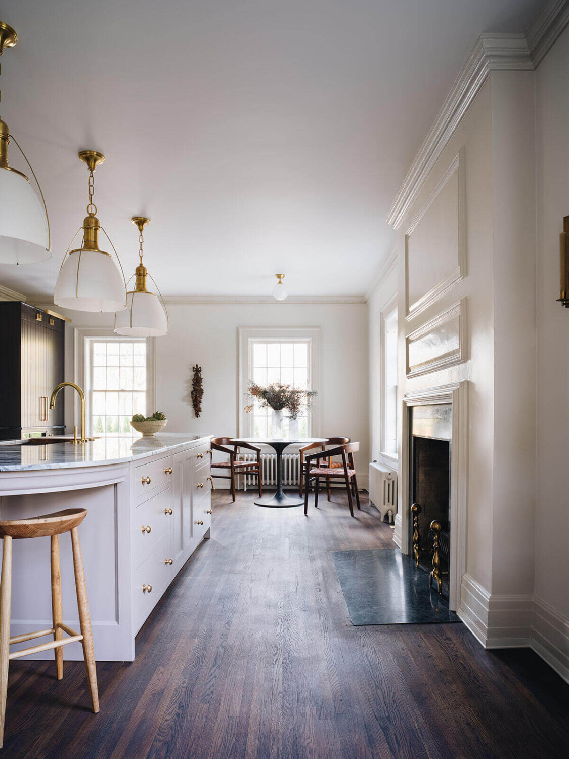 dark-wooden-floor-fireplace-window-seat-kitchen-island-nordroom