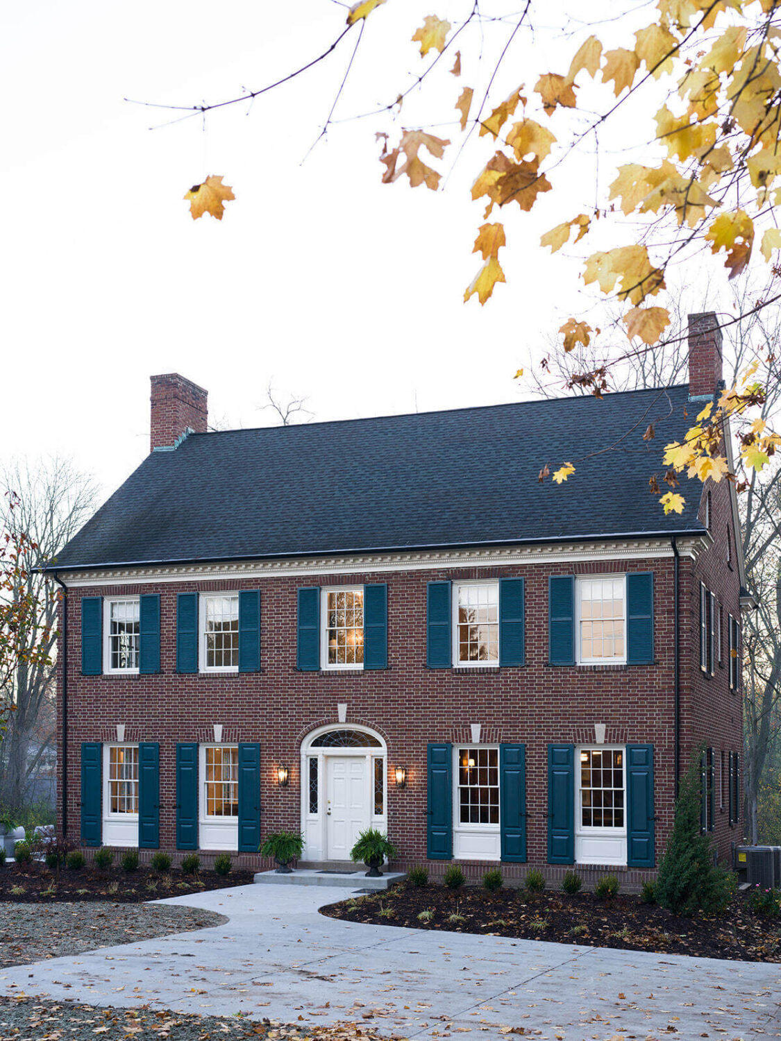 exterior-1930s-home-grand-rapids-blue-shutters-jean-stoffer-nordroom