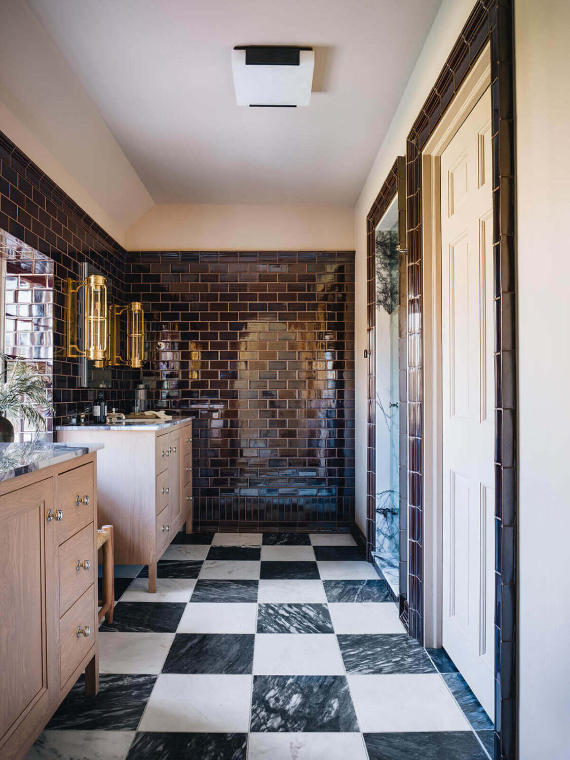 large-master-bathroom-black-white-checkerboard-floor-dark-blue-tiles-pink-vanity-nordroom