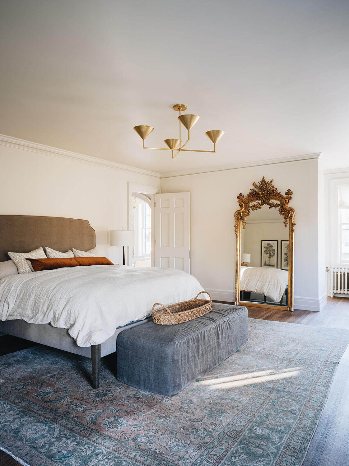 master-bedroom-antique-mirror-large-area-rug-jean-stoffer-interior-design-nordroom