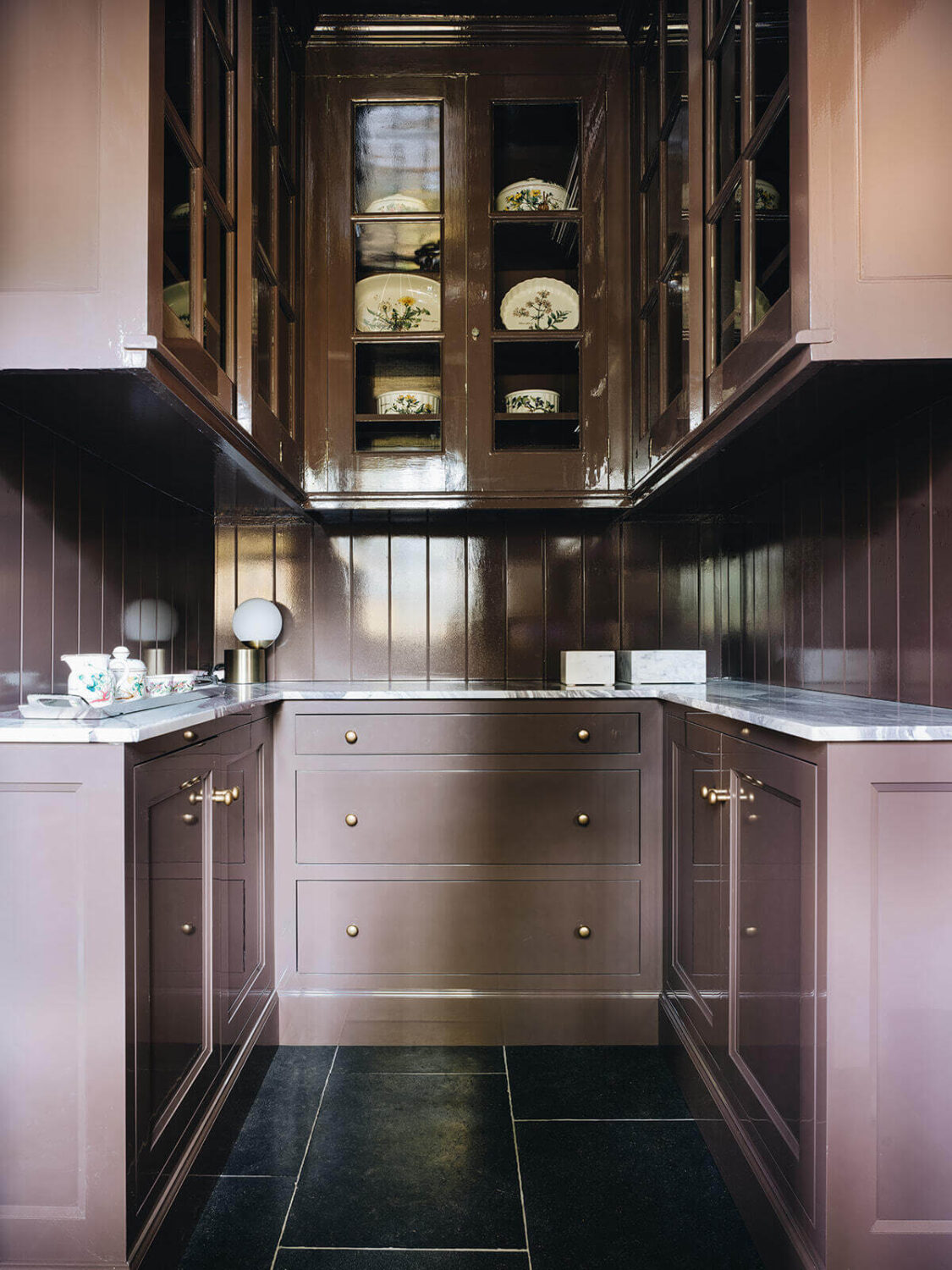 pantry-dark-gray-tiles-plum-colored-cabinets-nordroom