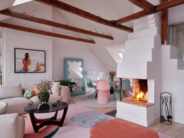 penthouse-living-space-fireplace-exposed-beams-pastel-color-accents-nordroom