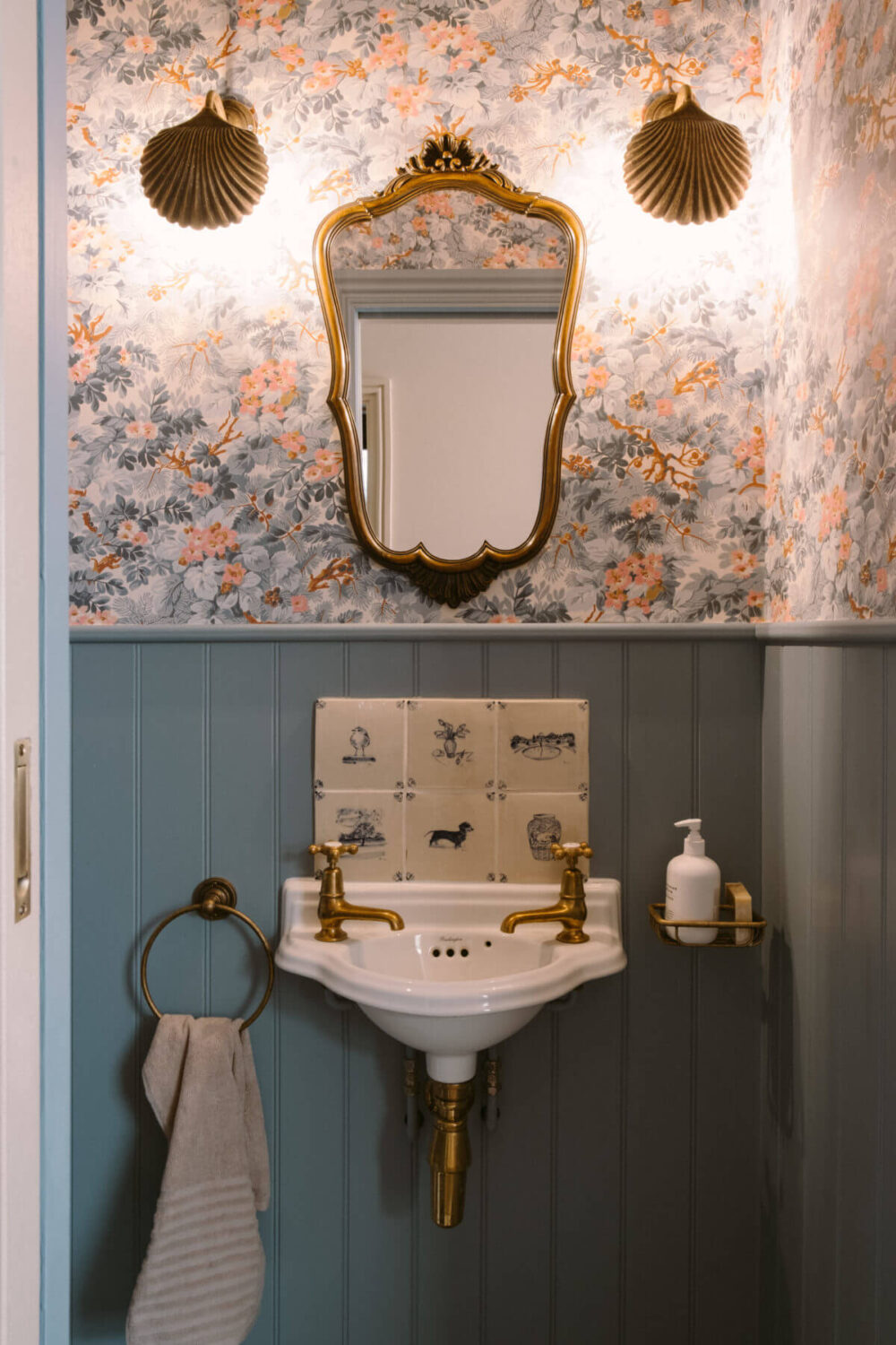 powder-room-wallpaper-antique-mirror-light-blue-wood-paneling-nordroom
