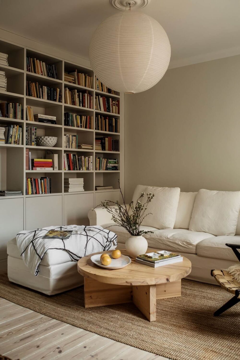 serene-living-room-built-in-bookcase-white-sofa-wooden-floor-nordroom