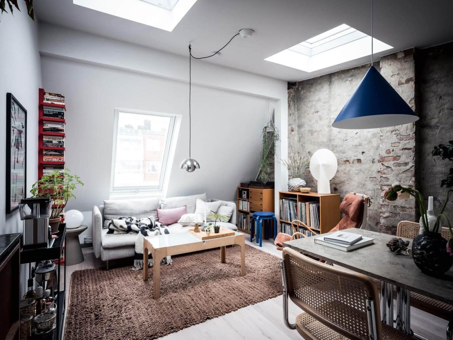 small-loft-sitting-area-skylights-exposed-brick-wall-nordroom