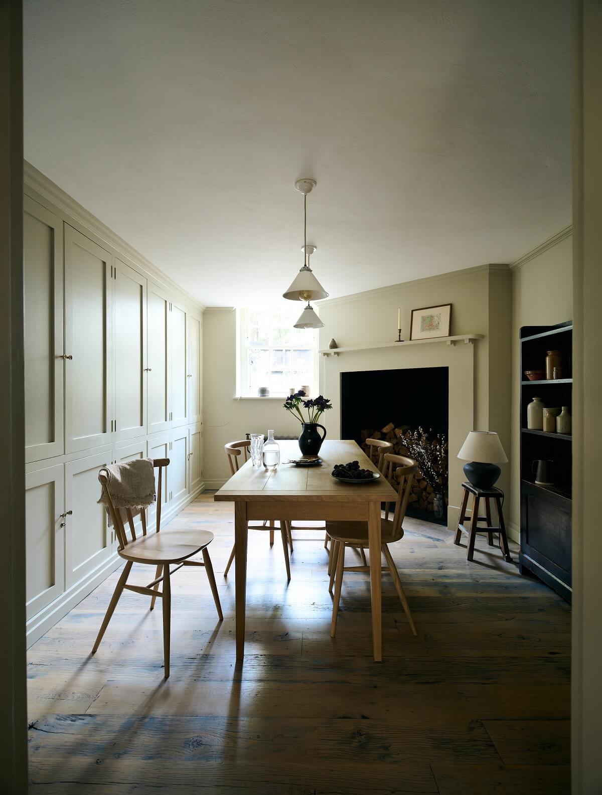 basement-kitchen-dining-table-wooden-floor-fireplace-nordroom