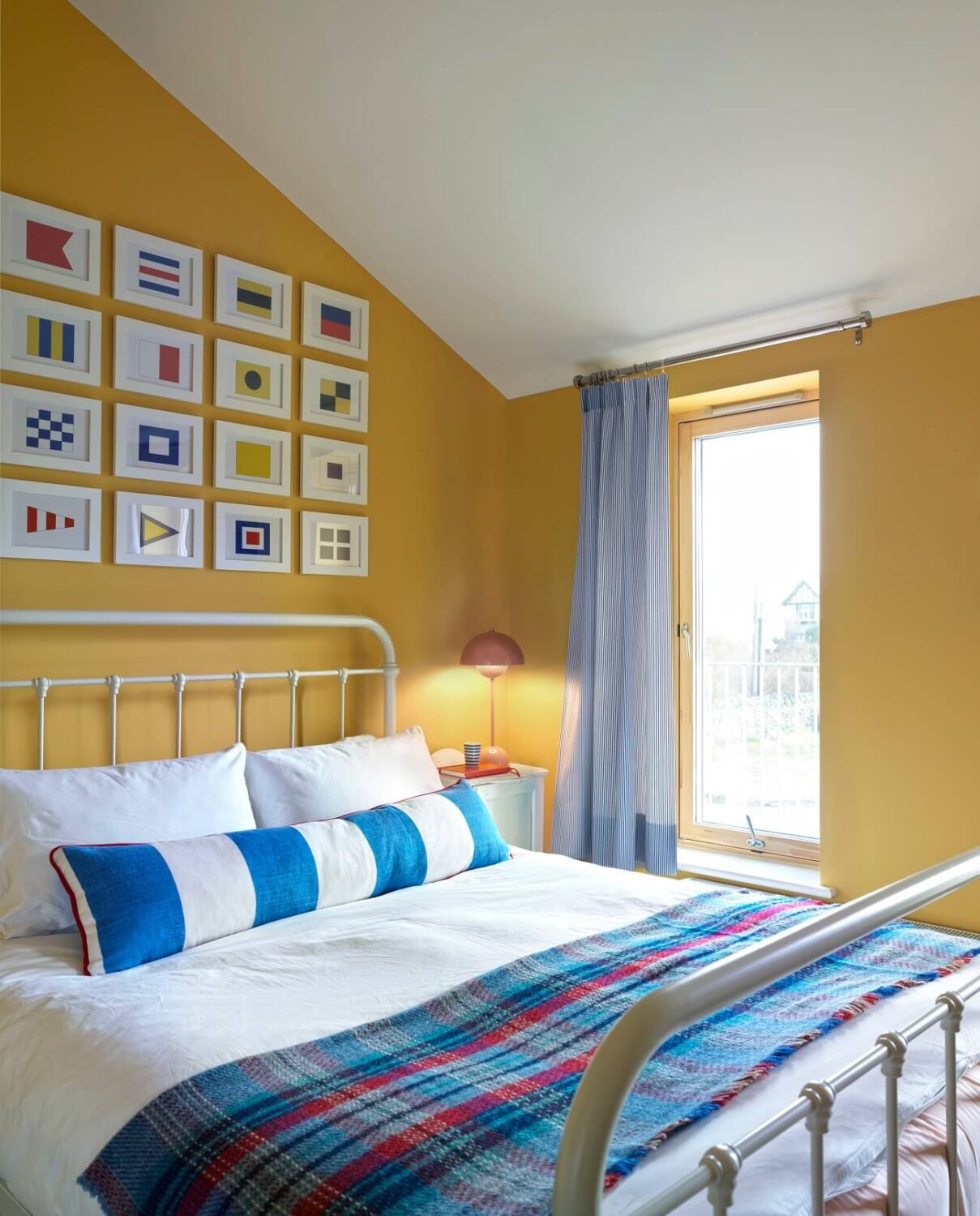 bedroom-yellow-walls-slanted-ceiling-nordroom