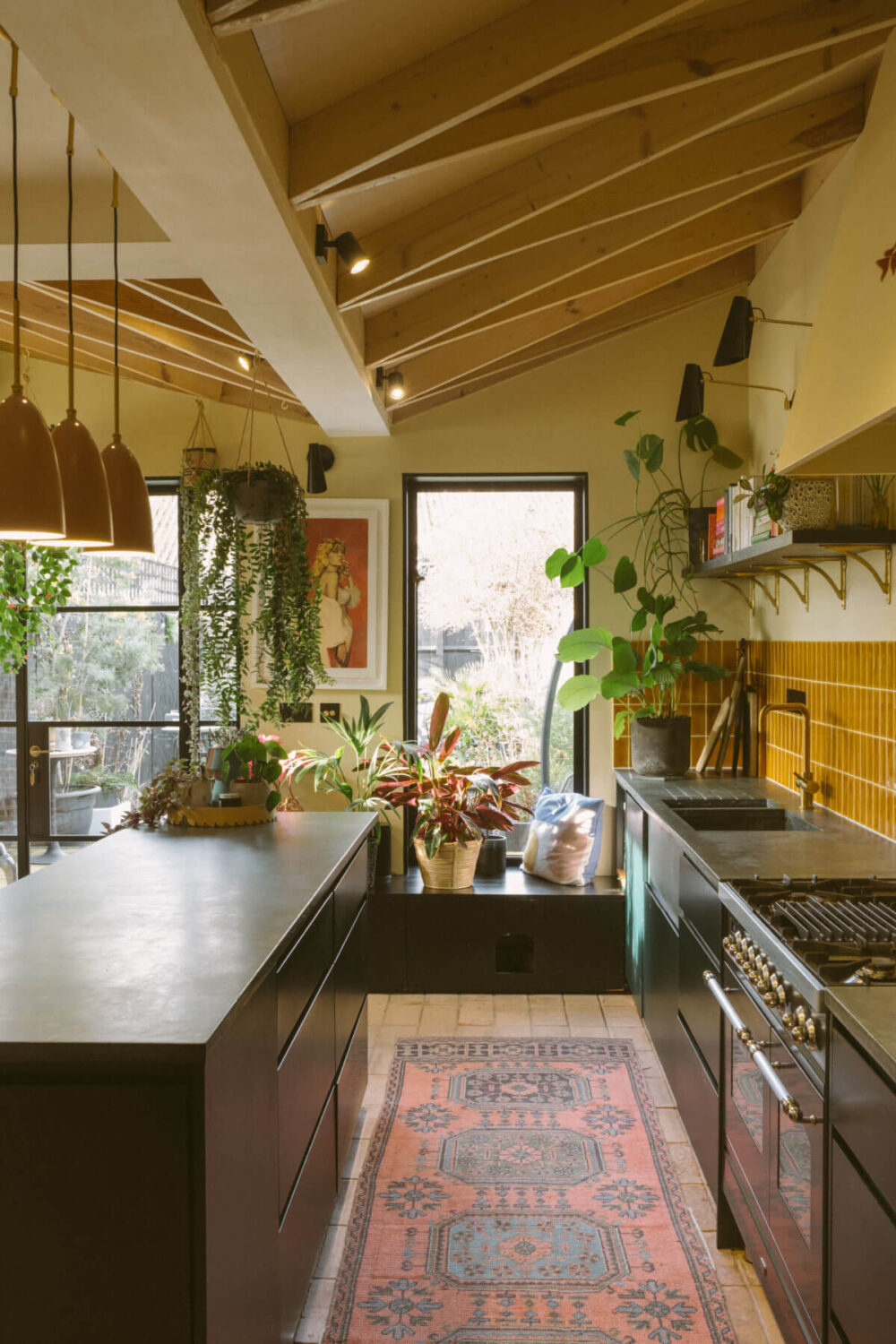black-kitchen-ochre-yellow-tiles-wooden-beams-slanted-ceiling-nordroom