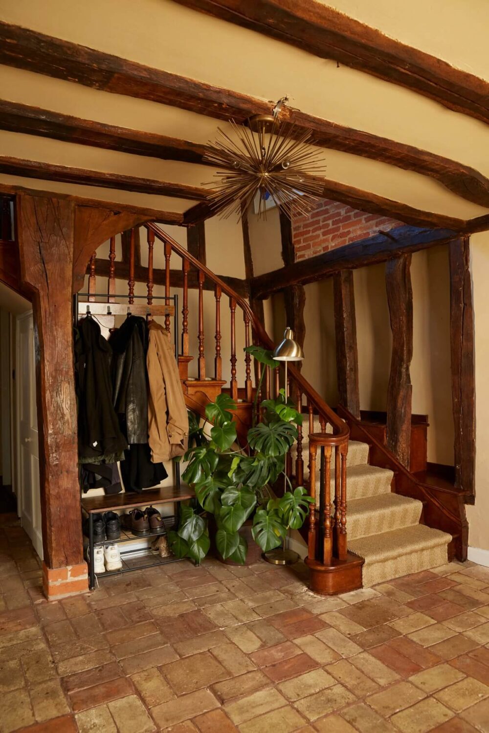 hallway-staircase-wooden-ceiling-beams-stone-floor-nordroom
