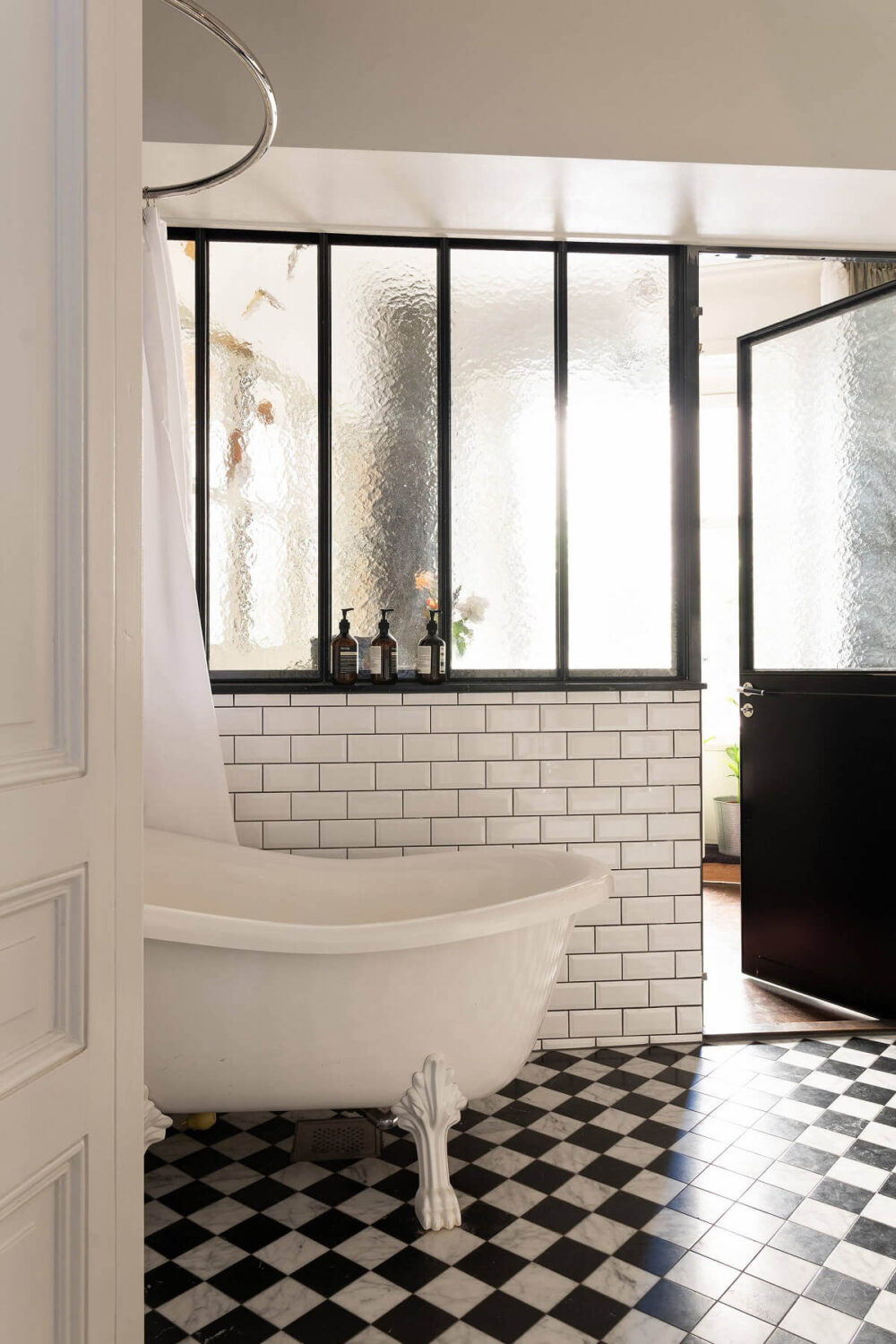 industrial-glass-windows-bathroom-freestanding-bath-black-white-checkerboard-floor-nordroom
