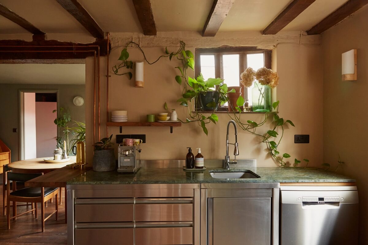 kitchen-small-window-plants-exposed-wooden-beams-nordroom