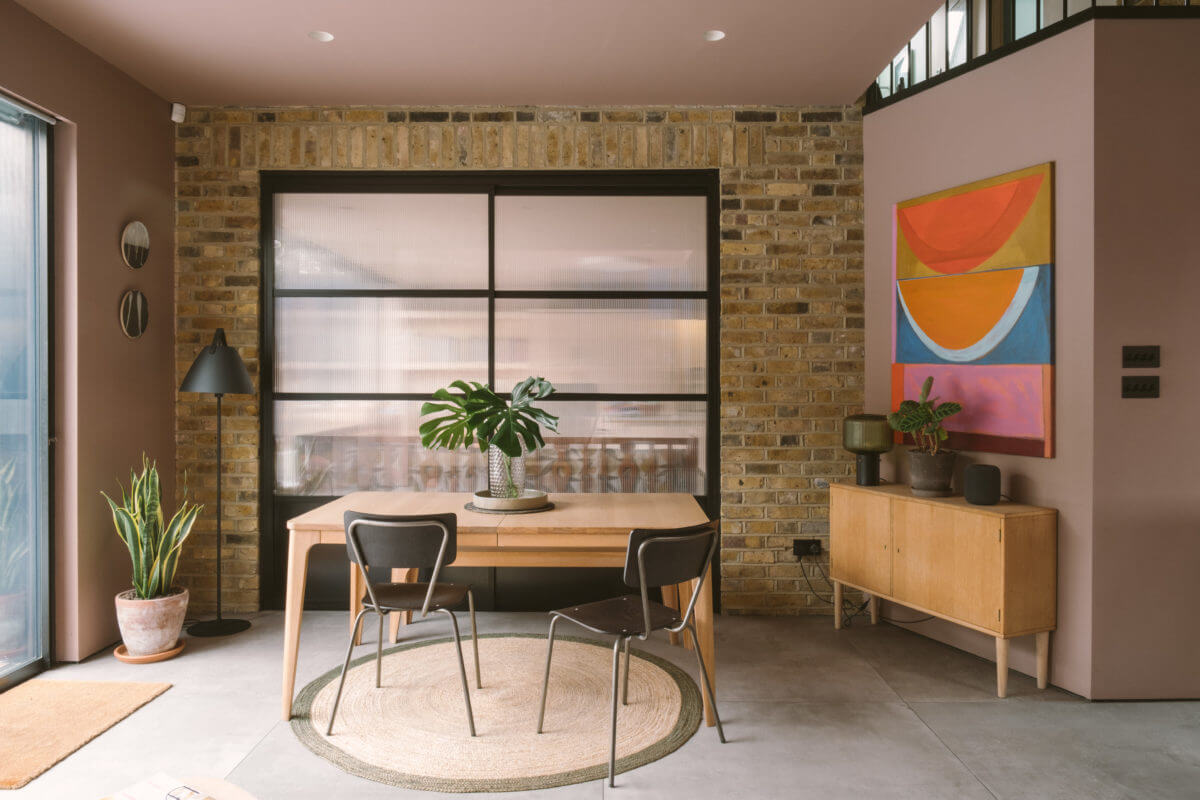 living-room-exposed-brick-wall-pink-walls-nordroom