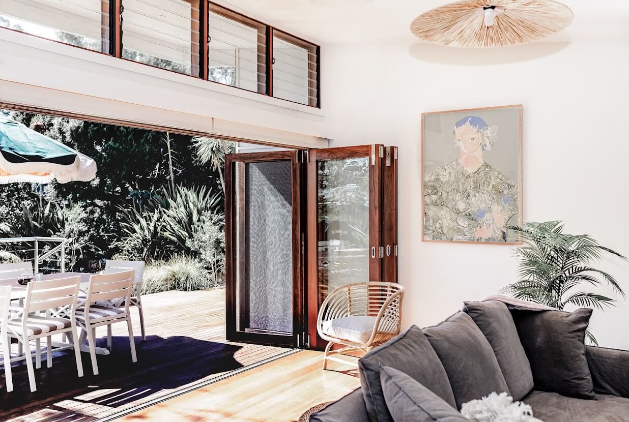 living-room-gray-sofa-folding-doors-indoor-outdoor-living-nordroom