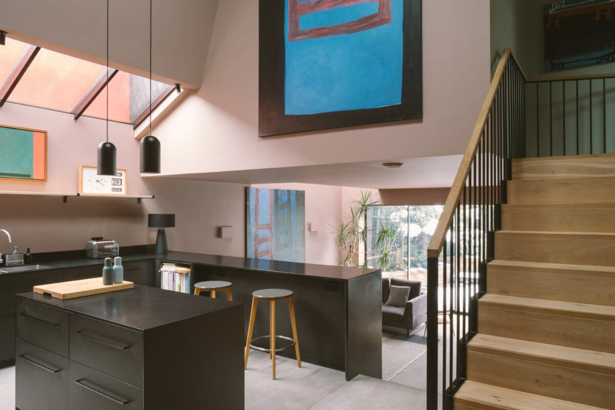 modern-black-kitchen-island-pink-walls-nordroom