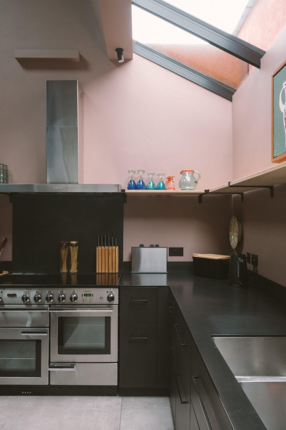 modern-black-kitchen-pink-walls-skylight-nordroom