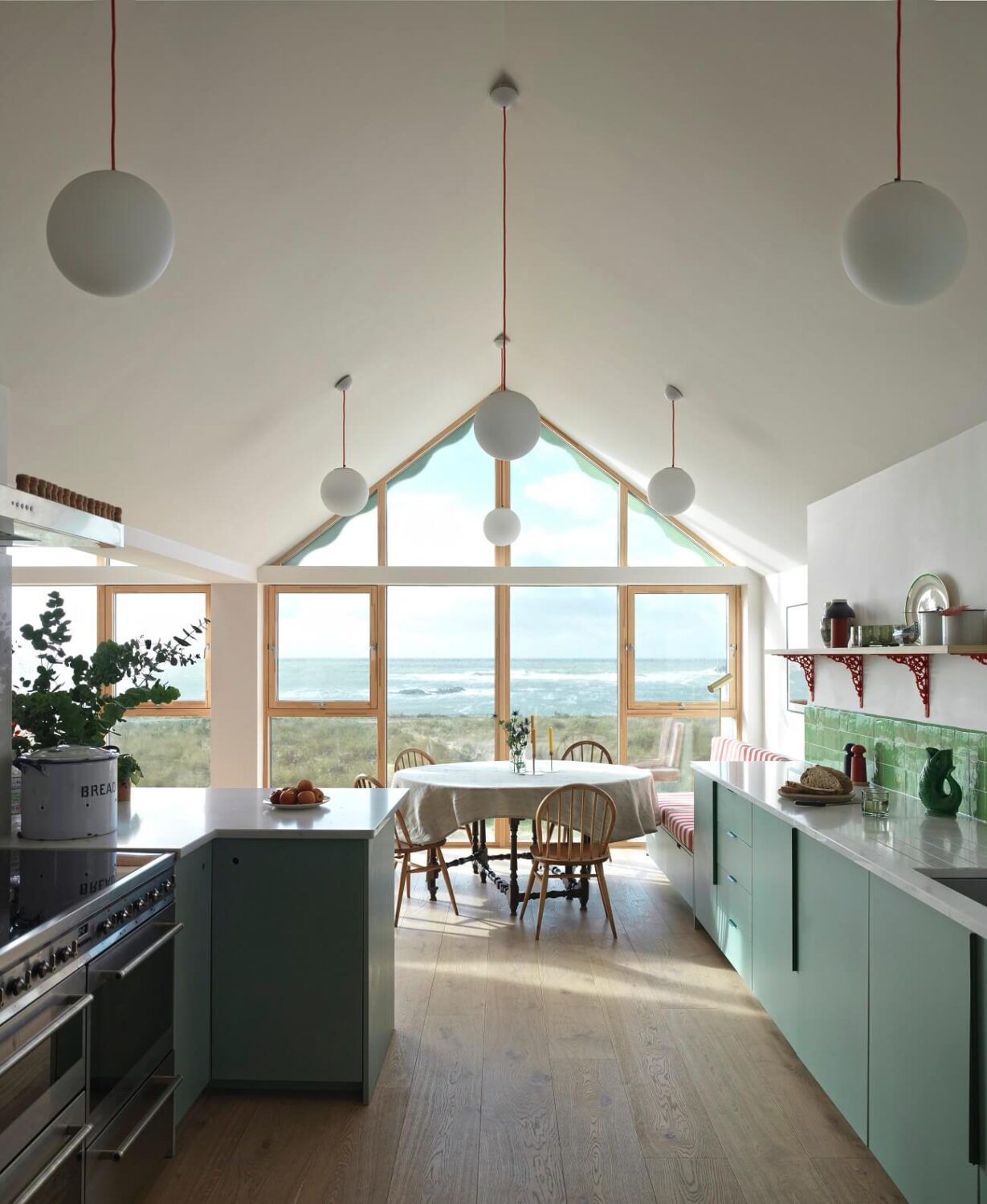 open-plan-kitchen-dining-room-pitched-ceiling-sea-view-nordroom