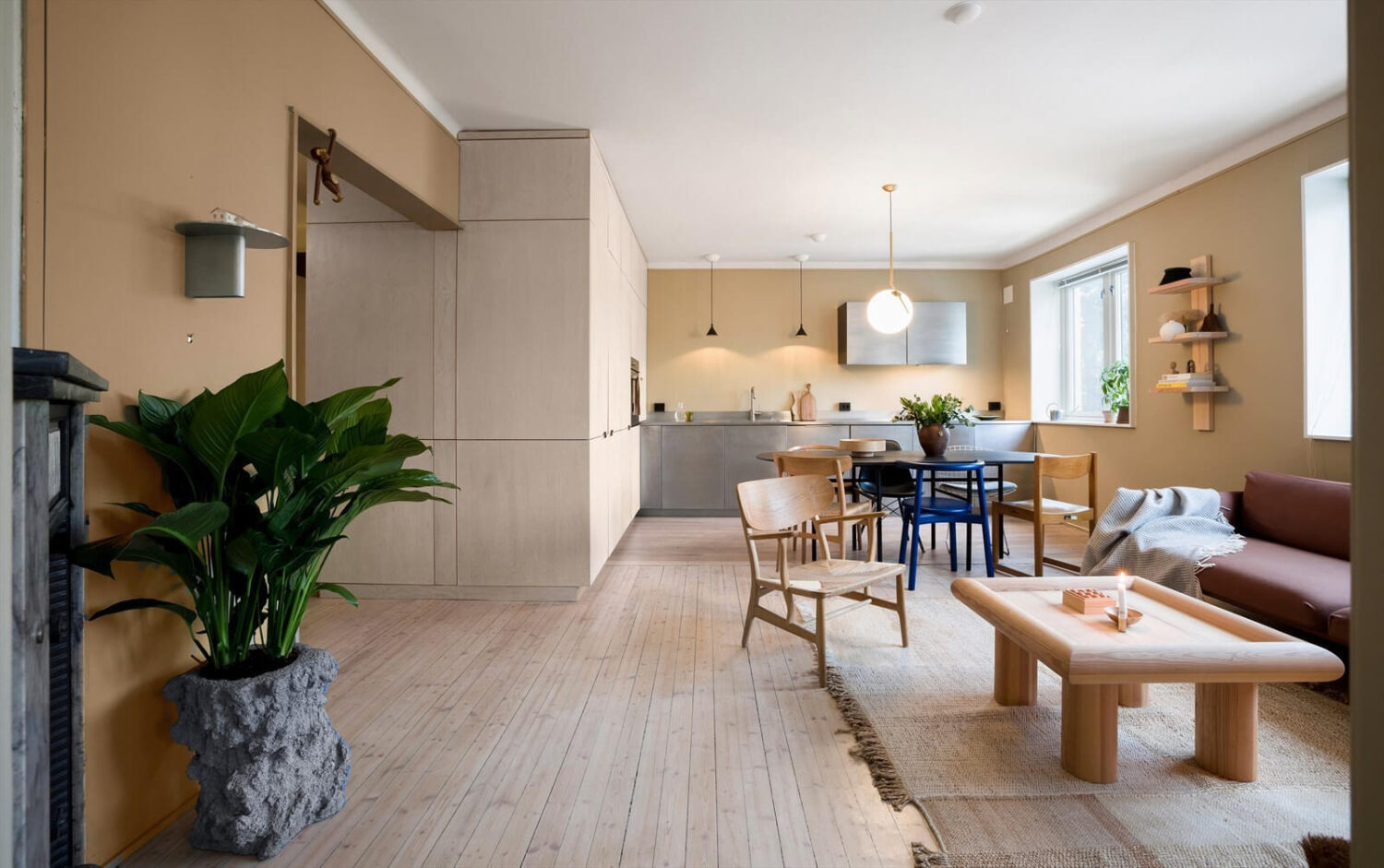 open-plan-living-room-kitchen-stainless-steel-custom-storage-nordroom