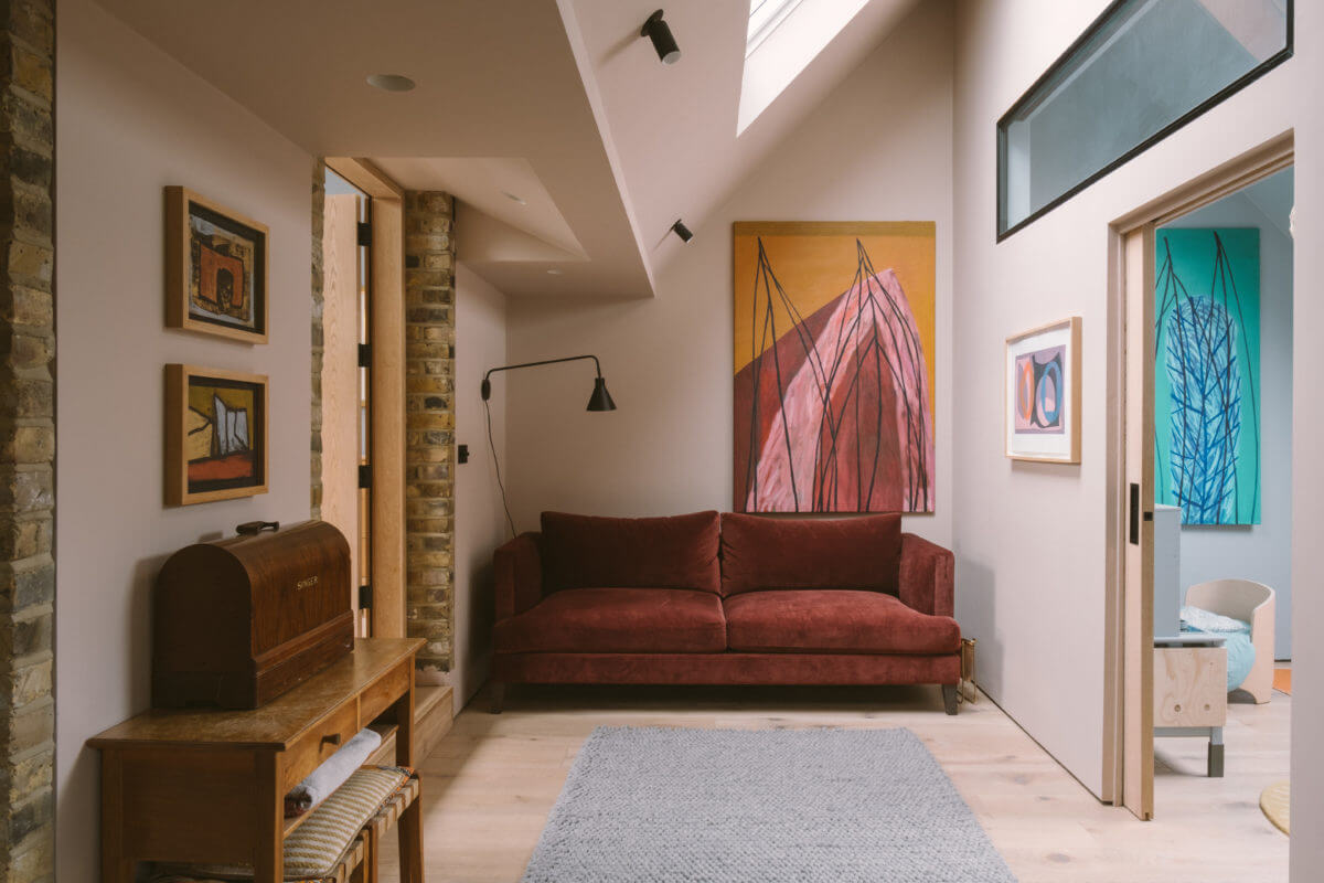 small-sitting-room-snug-earthy-red-sofa-skylight-art-nordroom