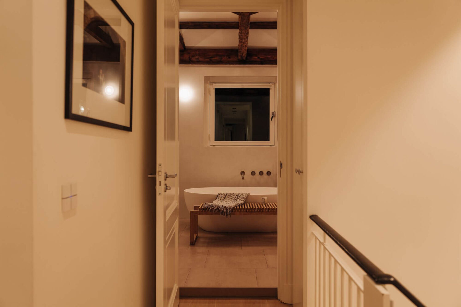 view-into-bathroom-exposed-wooden-beams-nordroom