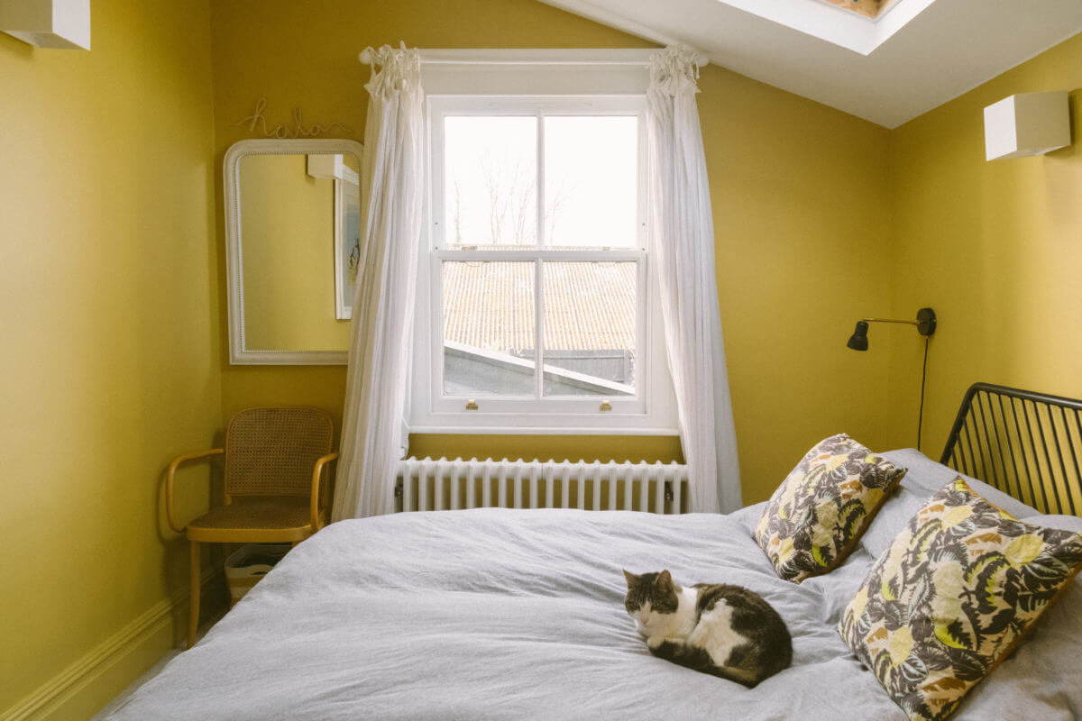 yellow-bedroom-slanted-ceiling-skylight-nordroom