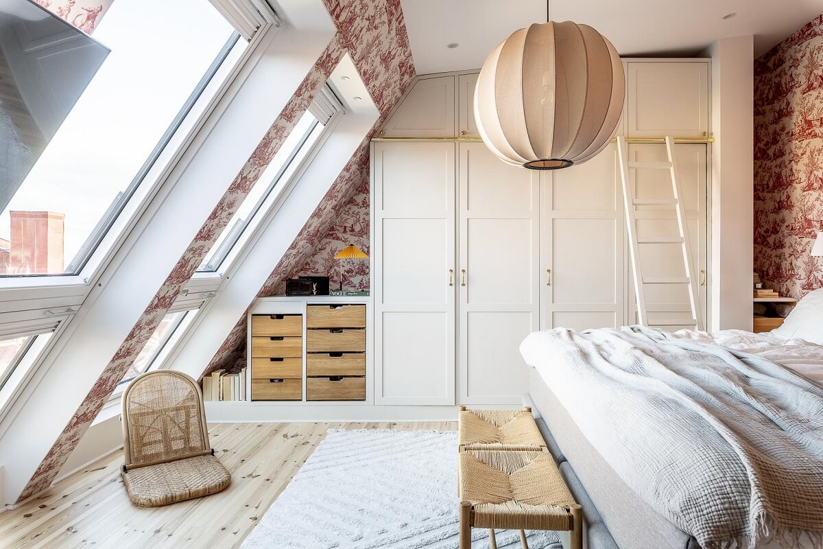 attic-bedroom-large-windows-wallpaper-built-in-wardrobes-nordroom