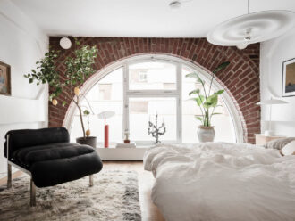 Picture of A Scandinavian Loft with Brick Wall and Arched Window - The Nordroom