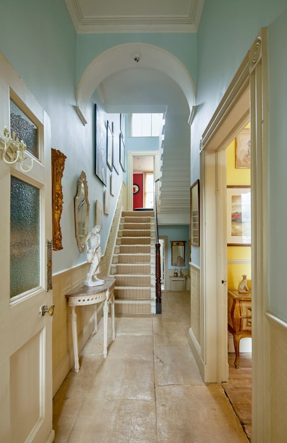 hallway-aged-flagstone-floor-light-blue-walls-nordroom