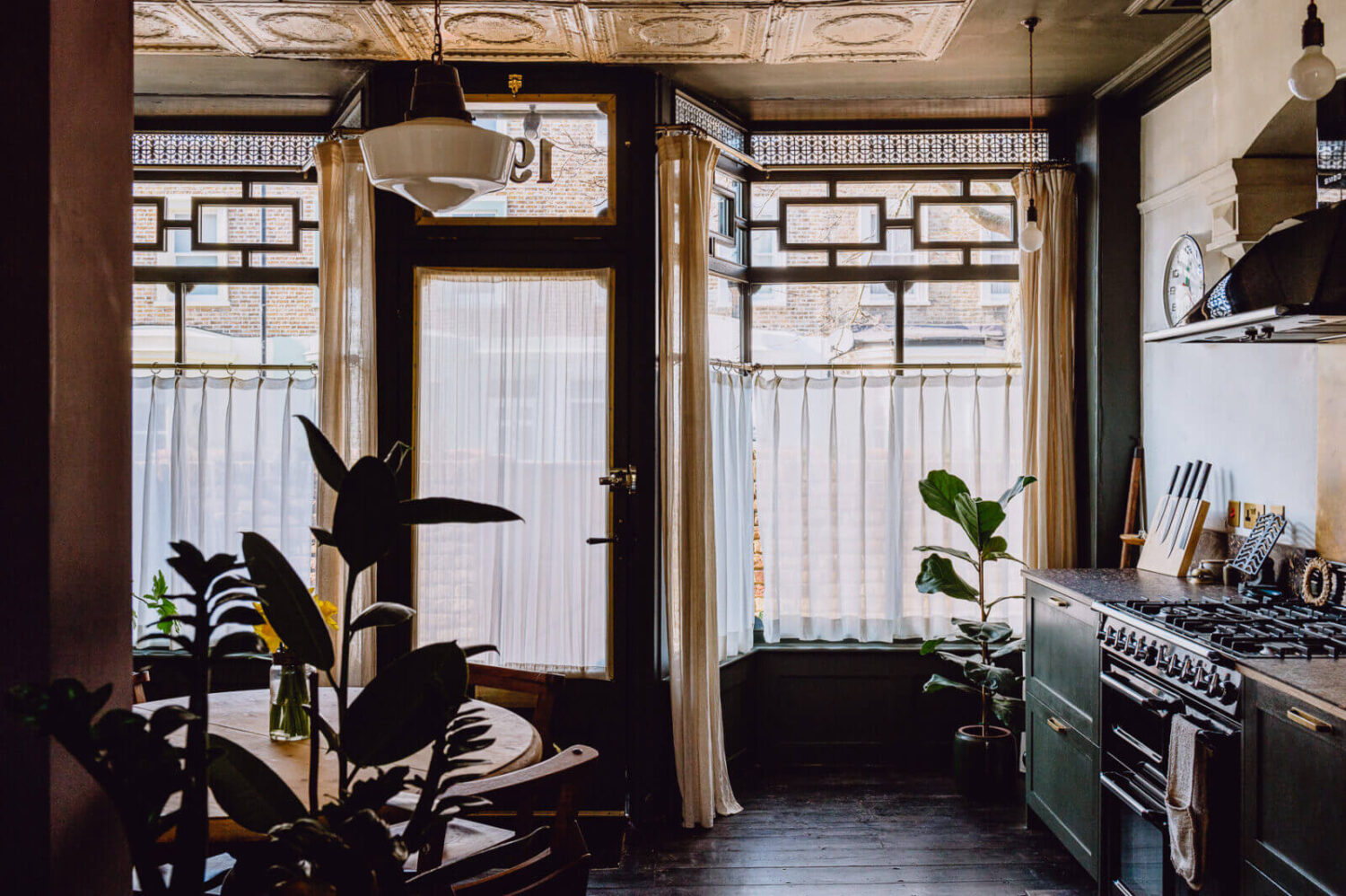 kitchen-historic-shop-windows-dark-green-cabinets-nordroom