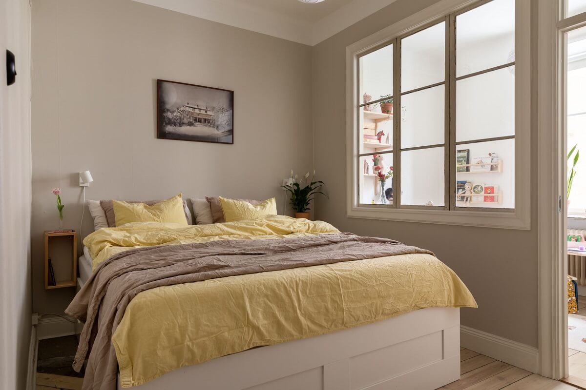 light-gray-walls-bedroom-yellow-bedding-nordroom