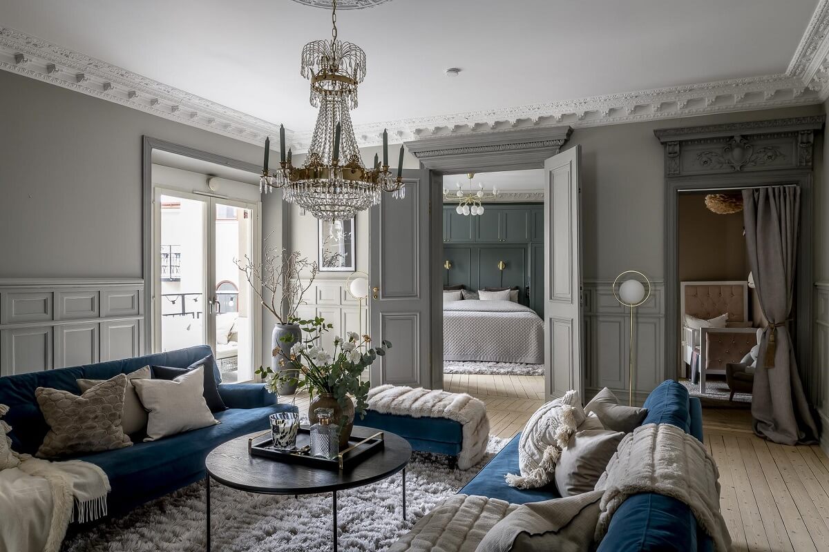 living-room-gray-walls-blue-sofa-historic-elements-nordroom