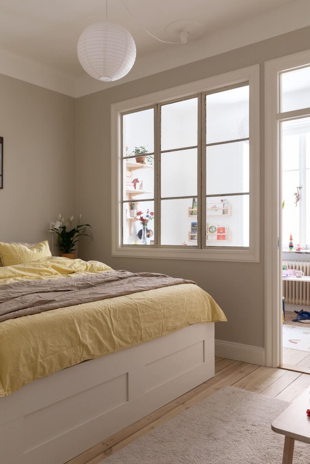 master-bedroom-indoor-window-light-gray-walls-wooden-floor-nordroom