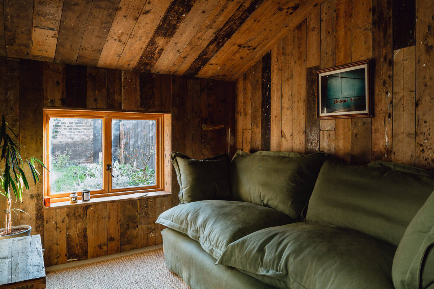 sitting-room-reclaimed-timber-walls-green-maker-and-son-sofa-nordroom