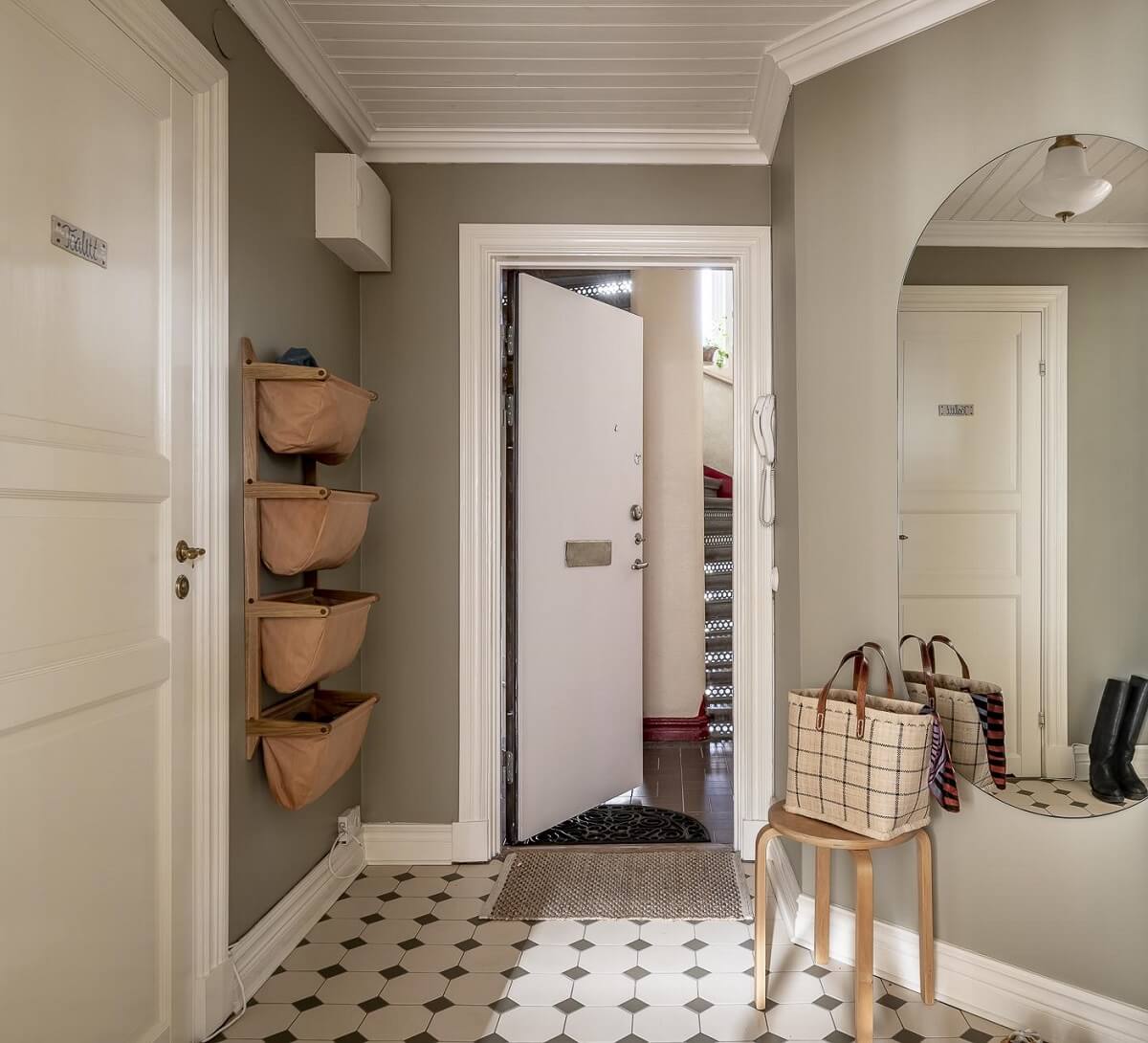 hallway-gray-walls-baskets-black-white-tile-floor-nordroom