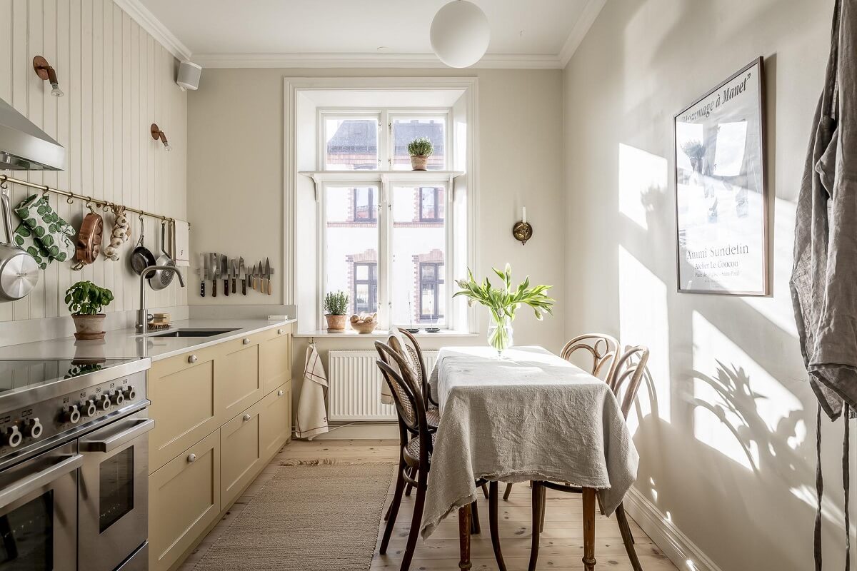 kitchen-dining-table-pale-yellow-cabinets-nordroom