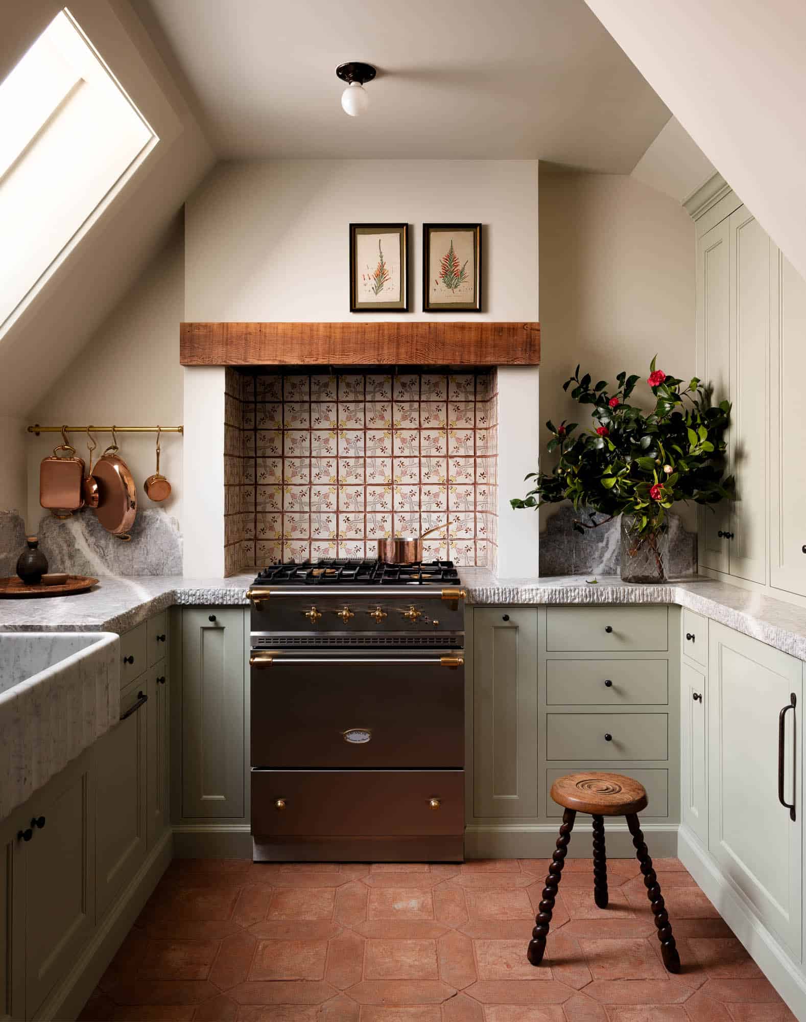 kitchen-light-green-cabinets-terracotta-floor-tiles-slanted-ceilings-nordroom